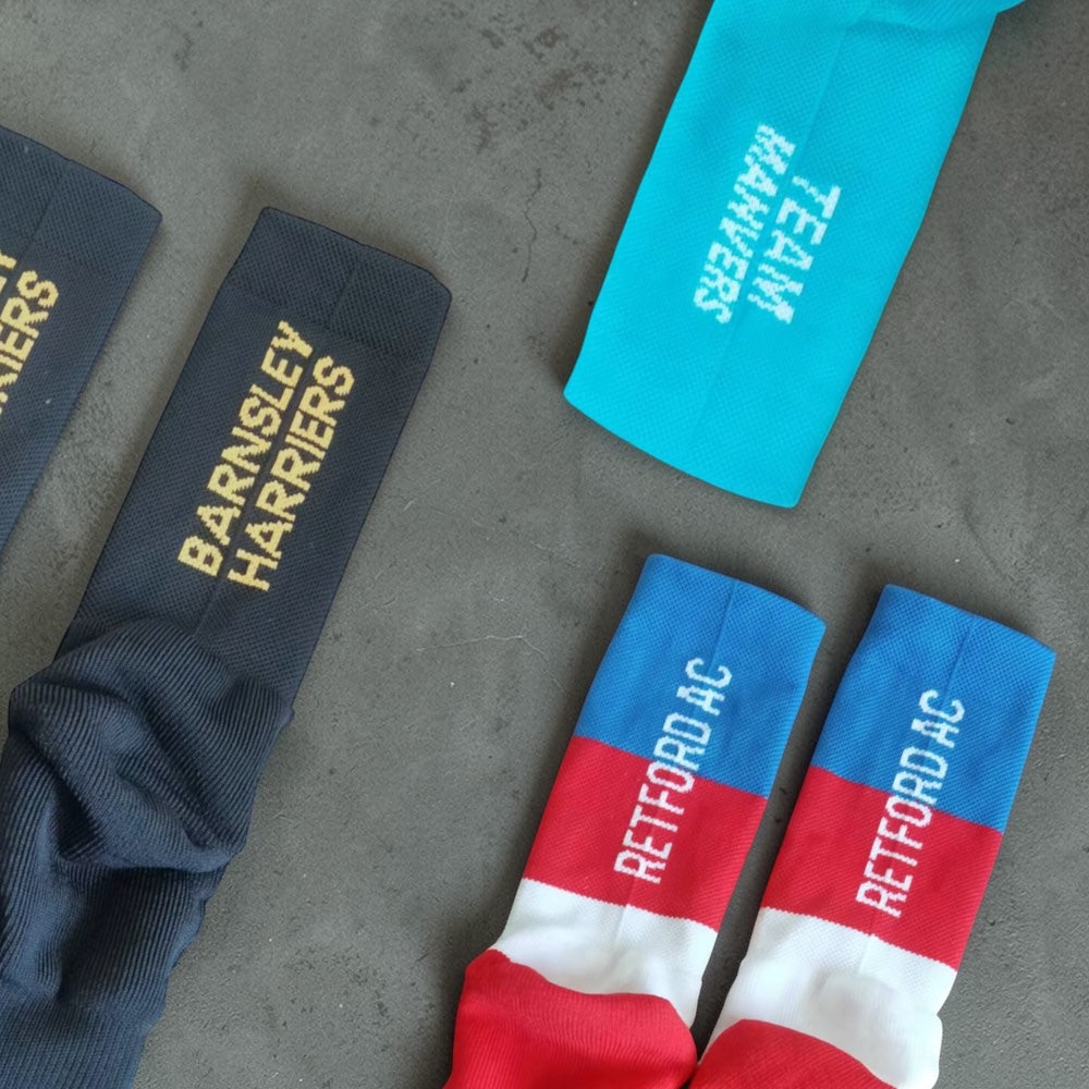 Selection of custom branded performance socks made by SPOX